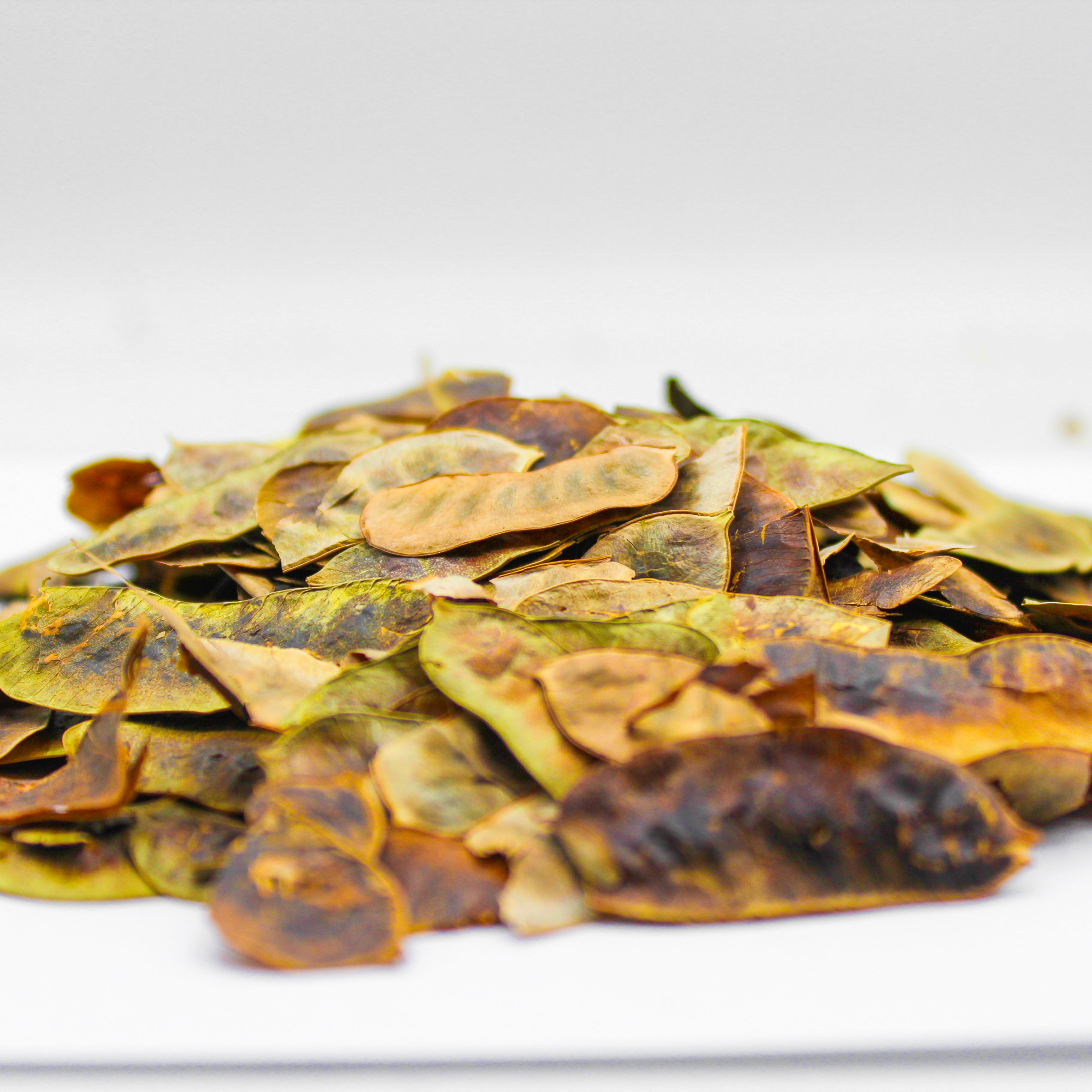 Botanical Name: Cassia angustifolia
Common Names:

English: Senna Pods, Cassia Pods
Hindi: सोनामुखी फलियां (Sonamukhi Phaliyaan)
Arabic: قرون السنا (Quroon al-Sana)
Japanese: センナポッド (Senna Poddo)
Other: Cassia angustifolia Fruits